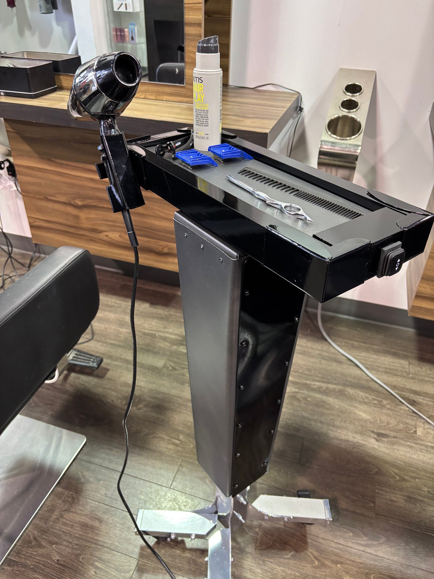 Motorized trolley with blow dryer holder